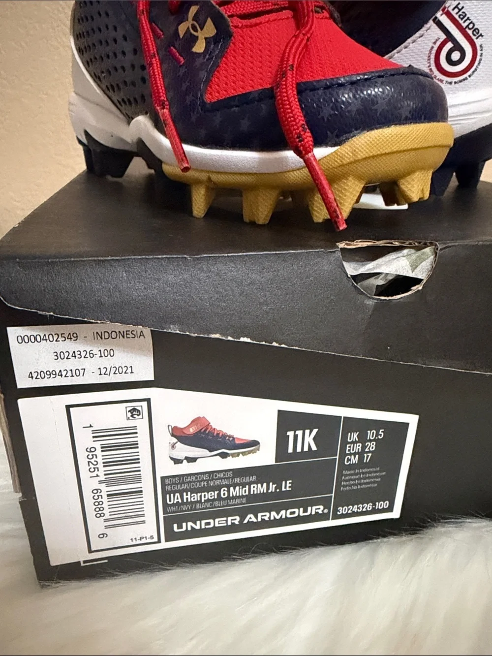 Under Armour Kids Red and Navy Football Cleats with Gold Accents